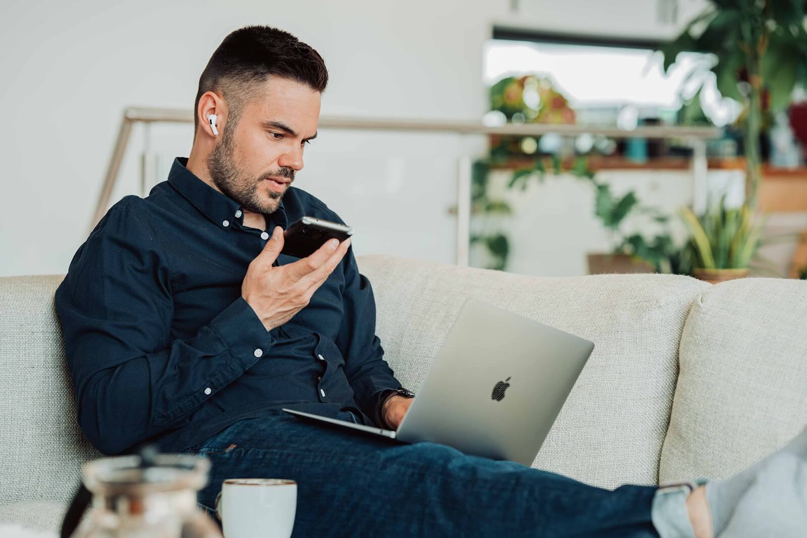 Man attempting to send voice note whilst searching online.